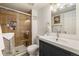Bathroom with a tiled shower, and vanity providing a functional and stylish space at 3482 S Eagle St # 102, Aurora, CO 80014