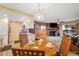 Dining area with kitchen access and fireplace-warmed living room at 3482 S Eagle St # 102, Aurora, CO 80014