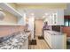 Bright kitchen boasting granite counters, stainless appliances and updated cabinets at 3482 S Eagle St # 102, Aurora, CO 80014
