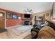 Relaxing living room with a stone fireplace, leather seating, balcony access, and neutral decor for a cozy ambiance at 3482 S Eagle St # 102, Aurora, CO 80014