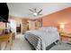 Spacious main bedroom with a ceiling fan, closet and an ensuite bathroom offers comfort and convenience at 3482 S Eagle St # 102, Aurora, CO 80014