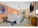 Comfortable main bedroom featuring ample natural light, carpet and ceiling fan at 3482 S Eagle St # 102, Aurora, CO 80014