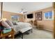 Comfortable main bedroom with great light, ceiling fan and seating at 3482 S Eagle St # 102, Aurora, CO 80014