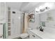 A modern bathroom featuring nice tiling, a large mirror, and a tiled shower at 595 S Alton Way # 1C, Denver, CO 80247