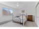 Cozy bedroom with a large window and carpet floors and a closet at 595 S Alton Way # 1C, Denver, CO 80247