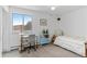 Relaxing bedroom with a desk, chair, view of the outside, and a comfortable bed at 595 S Alton Way # 1C, Denver, CO 80247