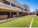 Exterior showcasing a fitness center and a bocce ball court offering diverse recreational options at 595 S Alton Way # 1C, Denver, CO 80247