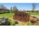 Community sign for Emerald Greens Golf Club with landscaping and blue skies at 595 S Alton Way # 1C, Denver, CO 80247
