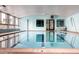 Bright indoor pool with large windows, offering a refreshing and well-lit swimming space at 595 S Alton Way # 1C, Denver, CO 80247