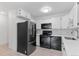 Modern kitchen with stainless steel appliances, white countertops, and stylish backsplash at 595 S Alton Way # 1C, Denver, CO 80247