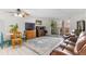 Cozy living room featuring a dining area, balcony access, and comfortable furniture at 595 S Alton Way # 1C, Denver, CO 80247