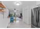 Open living space featuring a kitchen view, dining area, and comfortable seating at 595 S Alton Way # 1C, Denver, CO 80247