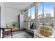 An enclosed patio with nice seating, an area rug, and a view of the outside at 595 S Alton Way # 1C, Denver, CO 80247