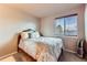 Cozy bedroom featuring a comfortable bed and a window that brings in natural light at 330 N Wagonwheel Trl, Castle Rock, CO 80104