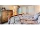 Bedroom featuring wood furnishings, neutral colors, and ensuite bathroom access at 330 N Wagonwheel Trl, Castle Rock, CO 80104