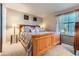 Bedroom with a large window, soft lighting, and cozy decor at 330 N Wagonwheel Trl, Castle Rock, CO 80104
