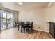 Bright dining area with balcony access and modern plank flooring at 330 N Wagonwheel Trl, Castle Rock, CO 80104