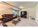 Cozy living room with comfortable leather sofa and entertainment center at 330 N Wagonwheel Trl, Castle Rock, CO 80104