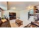 Spacious living room featuring a large TV and an entrance to a custom bar at 330 N Wagonwheel Trl, Castle Rock, CO 80104