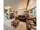 Basement living room featuring comfortable leather sofas and a custom bar at 330 N Wagonwheel Trl, Castle Rock, CO 80104