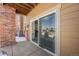 Covered back porch featuring a sliding glass door with views of the snow-covered outdoors at 804 Summer Hawk Dr # 8108, Longmont, CO 80504