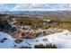 Beautiful aerial view of a ski resort nestled amidst snow-capped mountains and lush green forests at 1521 Ski Hill Rd # 8318, Breckenridge, CO 80424