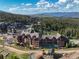 Picturesque aerial view of a summer resort, highlighting lush surroundings and mountain views at 1521 Ski Hill Rd # 8318, Breckenridge, CO 80424