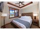Comfortable bedroom featuring a wood frame bed and a window with stunning mountain views at 1521 Ski Hill Rd # 8318, Breckenridge, CO 80424