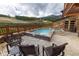Outdoor hot tub with stone patio and scenic mountain backdrop for ultimate relaxation at 1521 Ski Hill Rd # 8318, Breckenridge, CO 80424