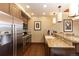 Contemporary kitchen with stainless steel appliances, granite counters, and tile backsplash at 1521 Ski Hill Rd # 8318, Breckenridge, CO 80424