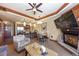 Spacious living room with a dining area, fireplace, comfortable furniture, and an open layout to the kitchen at 1521 Ski Hill Rd # 8318, Breckenridge, CO 80424