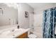Full bathroom with a shower-tub combo and wood vanity at 3065 W 80Th Ave, Westminster, CO 80030