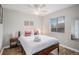 Bright bedroom with modern decor, featuring a ceiling fan and wood-look floors at 3065 W 80Th Ave, Westminster, CO 80030