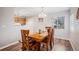 Cozy dining room with natural light, wood-look floors, and seating for four at 3065 W 80Th Ave, Westminster, CO 80030