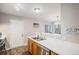 Functional kitchen area with updated countertops, stainless steel dishwasher, and natural light at 3065 W 80Th Ave, Westminster, CO 80030
