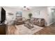 Comfortable living room with neutral tones, wood-look floors, and ample seating at 3065 W 80Th Ave, Westminster, CO 80030