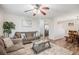 Open-concept living area with a ceiling fan, wood flooring, and lots of natural light at 3065 W 80Th Ave, Westminster, CO 80030