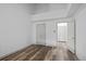 Spacious bedroom featuring laminate flooring, a ceiling fan, and two closets at 8422 S Upham Way # G60, Littleton, CO 80128