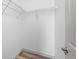 Walk-in closet with shelving and hardwood flooring at 8422 S Upham Way # G60, Littleton, CO 80128