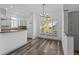 Bright kitchen featuring modern countertops and appliances with adjacent dining area at 8422 S Upham Way # G60, Littleton, CO 80128