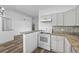 Bright kitchen featuring modern countertops, appliances, and hardwood floors and open layout at 8422 S Upham Way # G60, Littleton, CO 80128
