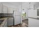 Bright kitchen featuring modern countertops, appliances, and hardwood floors at 8422 S Upham Way # G60, Littleton, CO 80128