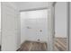 Convenient laundry room with laminate flooring and built in shelf at 8422 S Upham Way # G60, Littleton, CO 80128