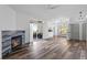 Living room features a fireplace, sliding doors to balcony, and hardwood floors at 8422 S Upham Way # G60, Littleton, CO 80128