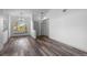 Spacious living room with hardwood floors, neutral walls, and natural light from a window at 8422 S Upham Way # G60, Littleton, CO 80128