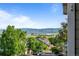 Scenic neighborhood view showcasing lush greenery and the mountain range on the horizon at 8422 S Upham Way # G60, Littleton, CO 80128