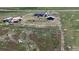 A home on acreage with RV parking, a barn, and fire pit at 11809 Pass Me By Rd, Strasburg, CO 80136