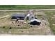 Spacious lot with a home, barn, fire pit, and RV parking space at 11809 Pass Me By Rd, Strasburg, CO 80136