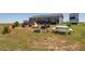 Backyard featuring an outdoor fire pit, lounge seating, and RV parking at 11809 Pass Me By Rd, Strasburg, CO 80136