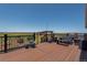 Beautiful deck with outdoor furniture overlooking a scenic field view at 11809 Pass Me By Rd, Strasburg, CO 80136